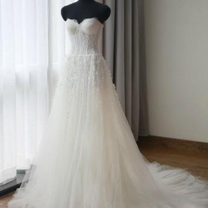 Floor Length Tulle Wedding Gown Featuring Crystal..