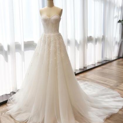 Floor Length Tulle Wedding Gown Featuring Crystal..