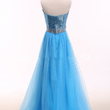 A Bright Blue Ball Gown With A Golden Tulle Gown..