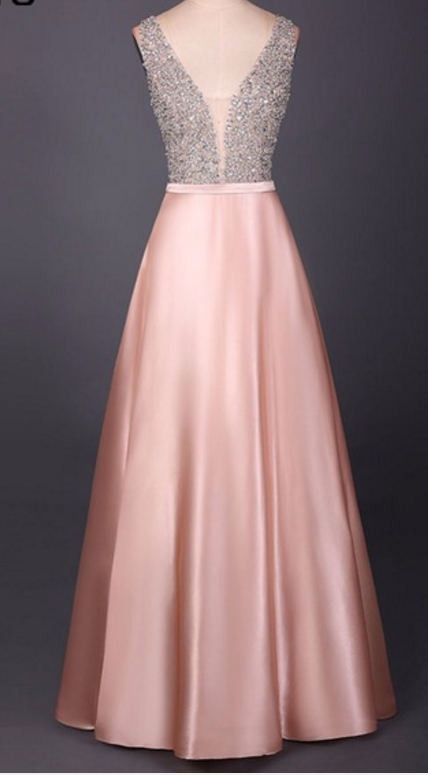 An Evening Dress Beaded With A V-neck, Sleeveless Gown