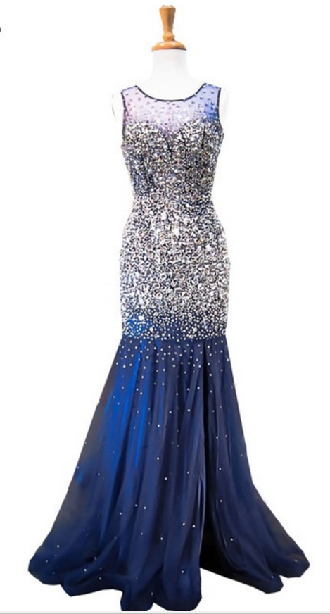 The deluxe mermaid scallop has a sleeveless crystal sparkling navy blue dress
