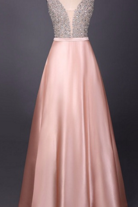 An Evening Dress Beaded With A V-neck, Sleeveless Gown