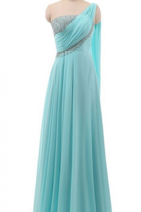 A Long, Green, Elegant Beaded Evening Gown With A Beautiful Chiffon Gown